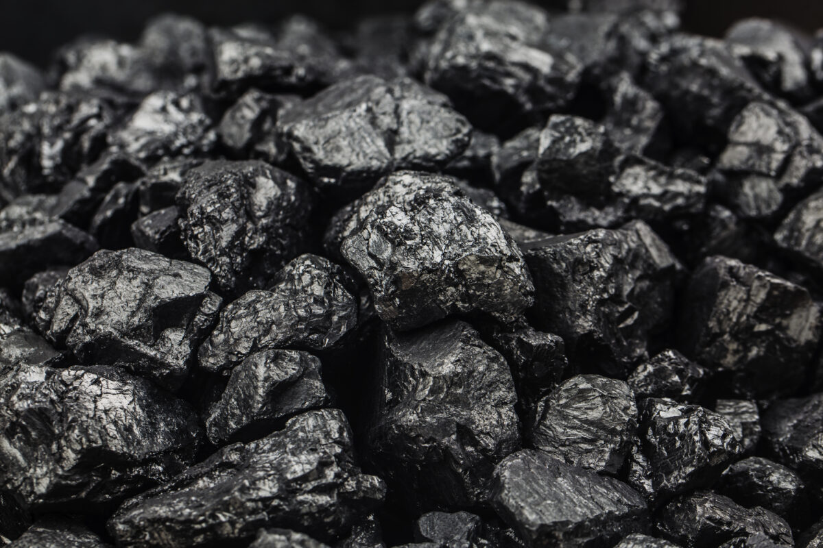 Heap of coal as background, top view